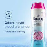 Promotional graphic with a Downy Fresh Protect bottle and text “Odors never stood a chance” over a blue background