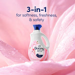 Downy Gentle Cherry Blossom bottle set against a soft pink floral background with '3-in-1' headline