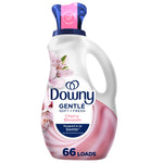 Bottle of Downy Gentle Soft + Fresh Cherry Blossom liquid fabric softener with pink label and blue cap