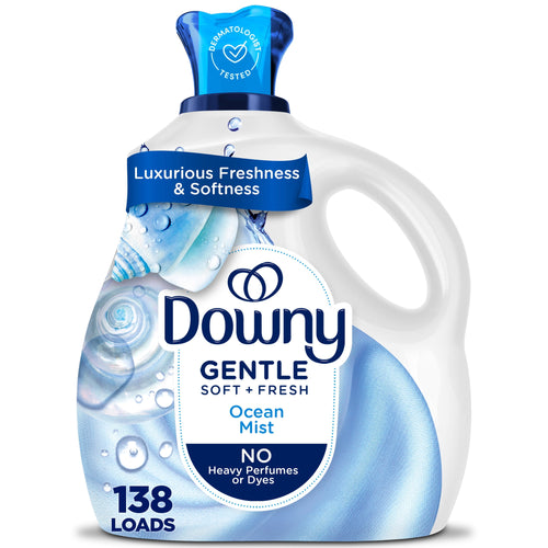White Downy Gentle fabric softener bottle with blue cap and ocean mist label artwork
