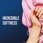 Hand holding soft pink fabric next to bold text reading “INCREDIBLE SOFTNESS” on a dark blue background.