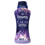 Tall purple bottle of Downy Infusions Calm in-wash scent booster, lavender & vanilla bean label and 26.5 oz callout