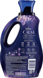 Rear view of a purple Downy Infusions Calm bottle showing product instructions, icons, and a barcode