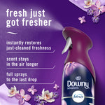 Close-up of purple Downy Infusions Febreze spray nozzle with copy listing benefits like restoring just-cleaned freshness and longer scent