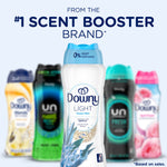 Promotional hero image of Downy Light Ocean Mist bottle fronted with blurred variant bottles and ‘#1 scent booster brand’ text