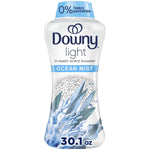 Tall white Downy Light Ocean Mist in-wash scent booster bottle with blue cap and coral graphic, 30.1 oz label visible