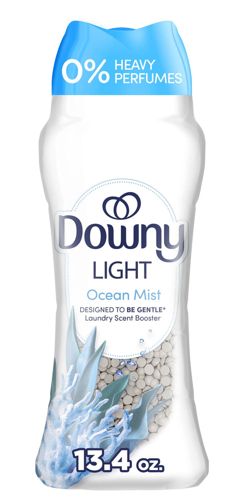 Tall Downy Light Ocean Mist scent booster bottle showing label, translucent window with white scent beads and blue cap