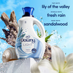 Downy Light Ocean Mist bottle with natural elements and fragrance notes: lily of the valley, fresh rain, sandalwood