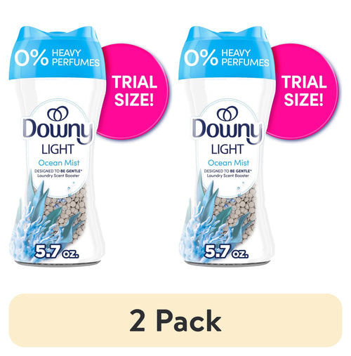 Two Downy Light Ocean Mist scent booster bottles labeled 0% heavy perfumes with pink ‘trial size’ badges and “5.7 oz.” callouts.