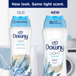 Side-by-side comparison graphic of old and new Downy Light Ocean Mist bottles highlighting updated packaging