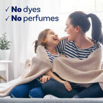 Smiling mother and child wrapped in a knitted blanket with overlay text 'No dyes' and 'No perfumes'.