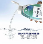 Downy Rinse & Refresh Cool Cotton bottle tilted and pouring a clear liquid with water splash and text about light freshness.