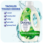 Bottle of Downy Rinse Out Odor fabric rinse with green label and callouts about tackling tough odors