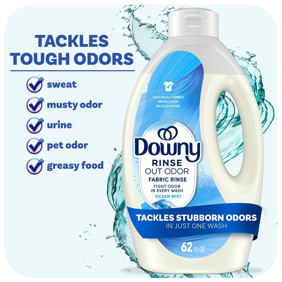Downy Rinse Out Odor fabric rinse bottle, Ocean Mist, white bottle with blue label and banner reading 'tackles stubborn odors', 62 fl oz visible