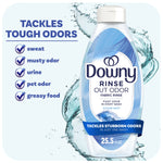 Close-up of a Downy Rinse Out Odor Ocean Mist bottle with water splash background and checklist of odors it tackles