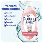 Downy Rinse Out Odor fabric rinse bottle in Spring Breeze design with callout list of tough odors it tackles