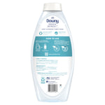 Rear view of a Downy Rinse & Refresh bottle showing how-to-use instructions, ingredient text, and a barcode.