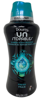 Black bottle of Downy Unstopables in-wash scent booster with turquoise cap and fresh graphic on front.