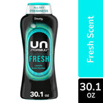 Close-up of a Downy Unstopables Fresh in-wash scent booster bottle showing black packaging and teal accents with 30.1 oz label