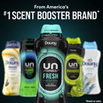 Advertising image of a Downy Unstopables Fresh bottle centered with blurred other Downy variants in background