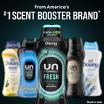 Centered Downy Unstopables Fresh bottle with blurred assortment of other Downy scent boosters and headline claim
