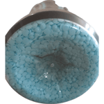 Close-up view of light blue scent booster beads visible through clear container base