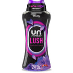 Black bottle of Downy Unstopables Lush laundry scent booster with purple floral graphics and 24 oz label