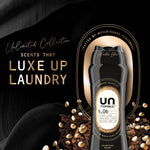 Downy Unstopables N.06 bottle on a black textured backdrop with text ‘Luxe Up Laundry’ and floating scent beads.