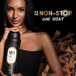 Model holding a black Downy Unstopables N.06 bottle beside bold text ‘24 HR NON-STOP LUXE SCENT’ and clove imagery.