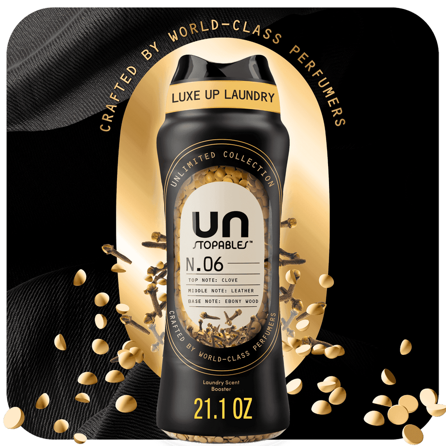 Downy Unstopables Unlimited Collection N.06 in-wash scent booster bottle with gold beads and black-and-gold packaging, 21.1 oz label visible