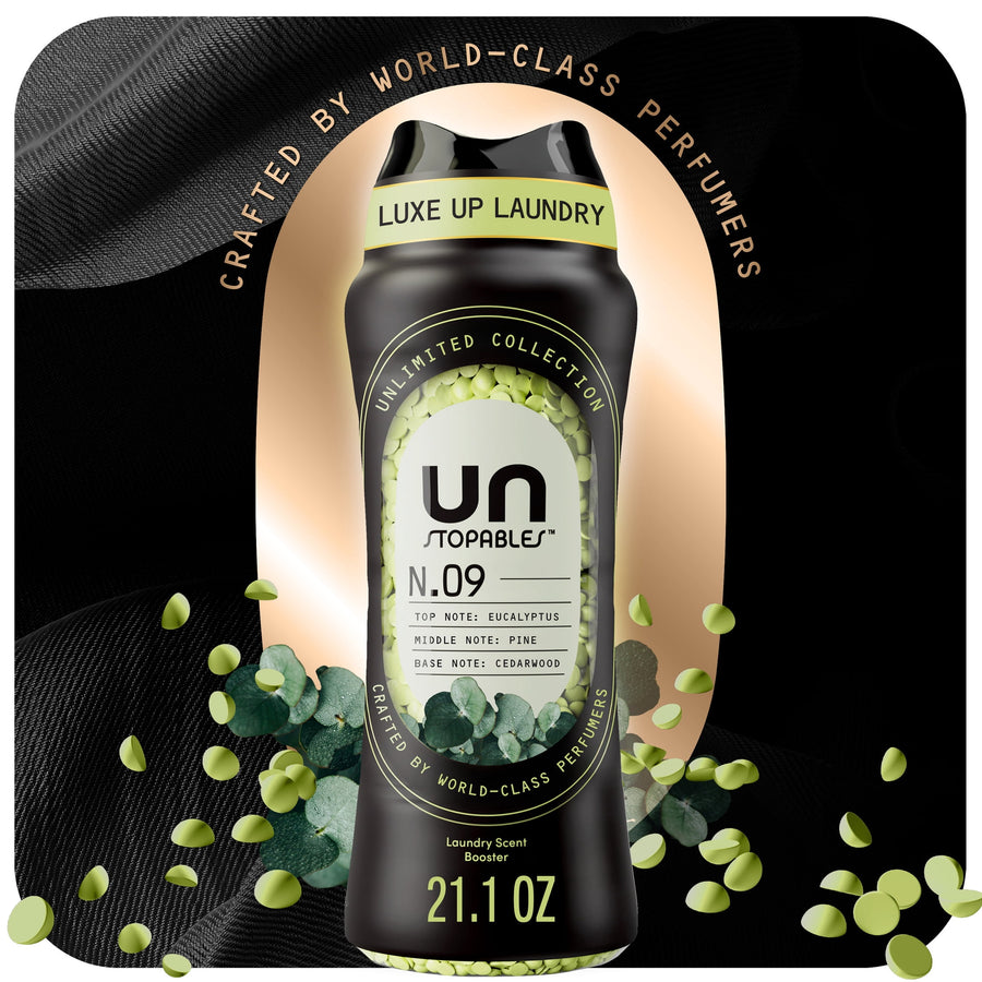 Black bottle of Downy Unstopables N.09 scent beads with eucalyptus visuals and scattered green beads