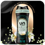 Bottle of Downy Unstopables Unlimited Collection N.11 scent booster beads with floral accents and gold backdrop.