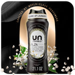 Black Downy Unstopables N.24 scent booster bottle with visible white scent beads and floral accents on a dark luxe background