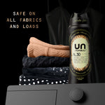 Black Downy Unstopables N.30 bottle shown near folded clothes and a washing machine control knob with safety claim text
