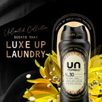 Downy Unstopables N.30 bottle with gold text 'Luxe Up Laundry' and yellow floral graphics on a black background
