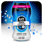 Close-up of a Downy Unstopables Odor Defense Daybreak + Clean bottle with blue scent beads and radiant blue background