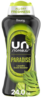 Tall black bottle of Downy Unstopables Paradise laundry scent booster with green leaf graphics and 24.0 oz label