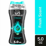 Close-up of a Downy Unstopables Fresh in-wash scent booster black bottle with teal cap and droplet graphic, 5.0 oz label visible.