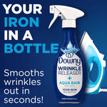 Downy Wrinkle Releaser Aqua Rain bottle beside an iron on a blue background with text 'Your iron in a bottle'