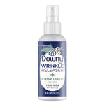 Front view of a 3 fl oz Downy Wrinkle Releaser Crisp Linen fabric spray bottle with label and spray nozzle