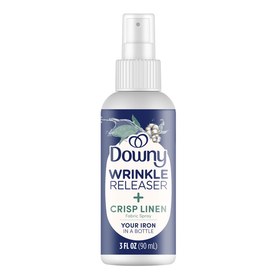 Front view of a 3 fl oz Downy Wrinkle Releaser Crisp Linen fabric spray bottle with label and spray nozzle