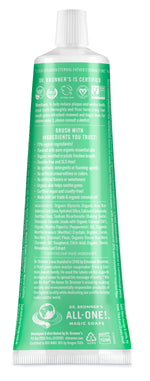 Rear view of a green Dr. Bronner's All-One toothpaste tube with ingredient and certification text visible