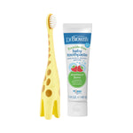 Dr. Brown's giraffe-shaped training toothbrush standing beside a tube of strawberry baby toothpaste on white background