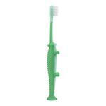Green crocodile toddler toothbrush standing upright showing bristles, textured spine and suction-cup base against white background.