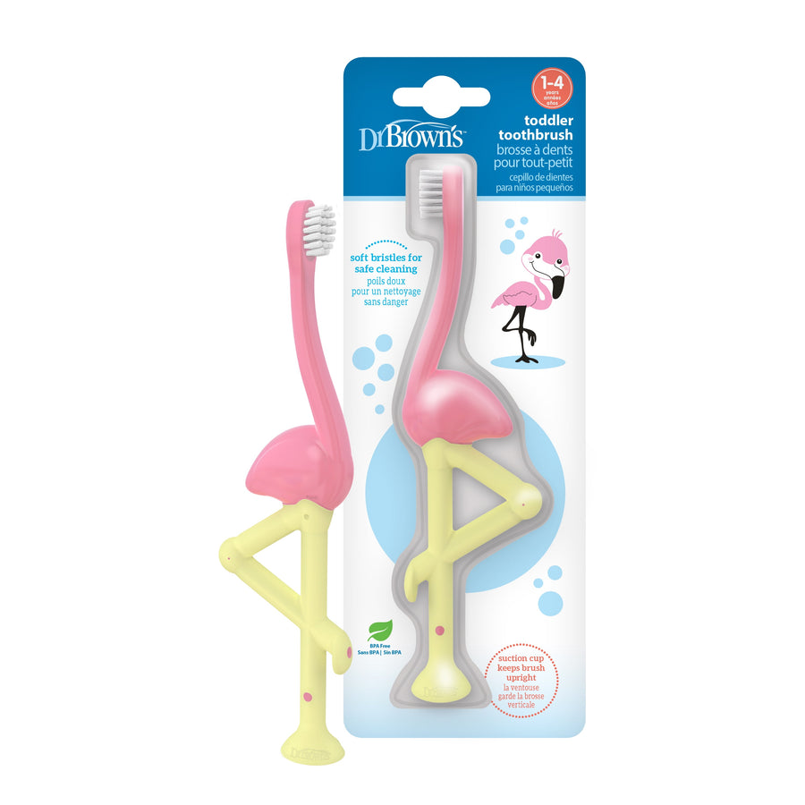 Dr. Brown’s pink flamingo toddler toothbrush in packaging showing pink head and yellow leg handle with illustrated flamingo