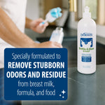 Dr. Brown's Bottle & Dish soap bottle on a kitchen counter with overlay text 'Specially formulated to REMOVE STUBBORN ODORS AND RESIDUE' and a blurred person washing a bottle in the background