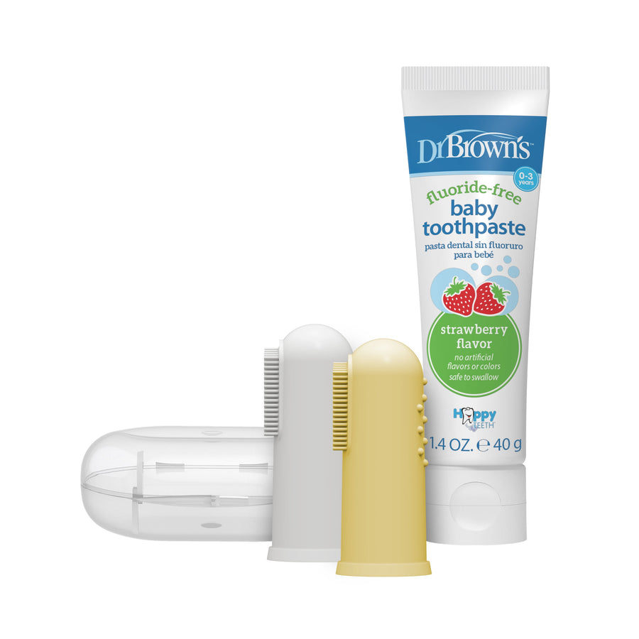 Dr. Brown's fluoride-free strawberry baby toothpaste tube displayed with two silicone finger toothbrushes and a clear storage case