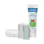 Dr. Brown's fluoride-free baby toothpaste tube next to two silicone finger toothbrushes and a clear storage case on white background.