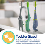Three toddler animal toothbrushes standing on a bathroom counter with marketing badge reading 'Toddler Sized'