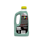 Rear view of a green Drano Build-Up Remover bottle showing instructions, caution panel and barcode